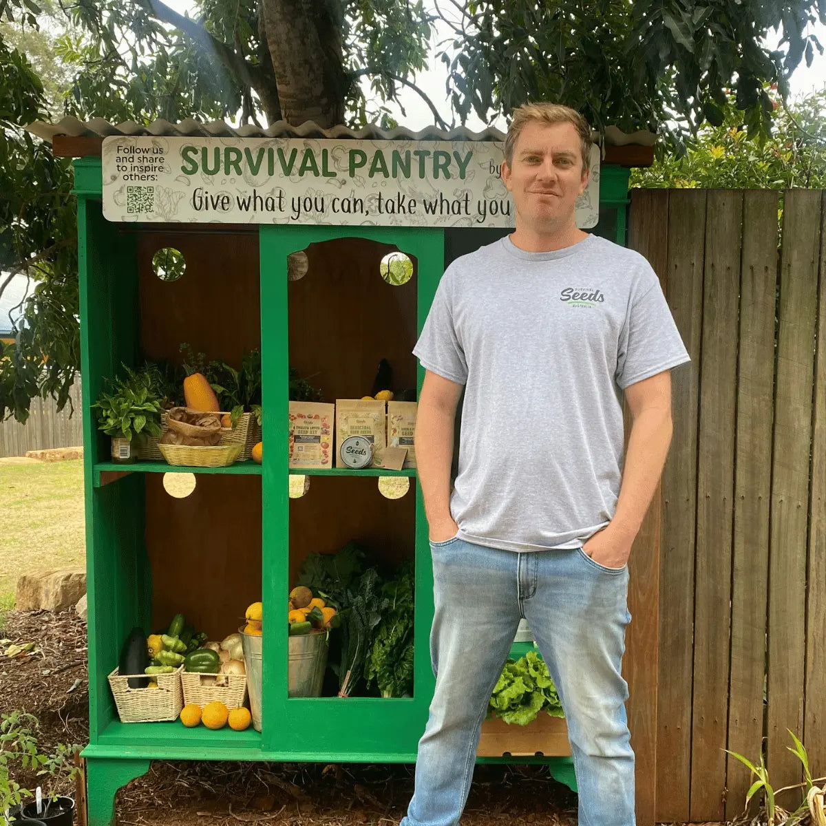 man standing in front of survival pantry 