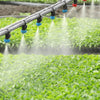 open sprinklers watering the crops