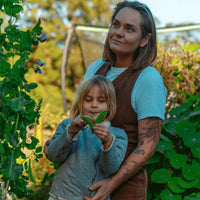 Mother & Daughter Growing Vegetables