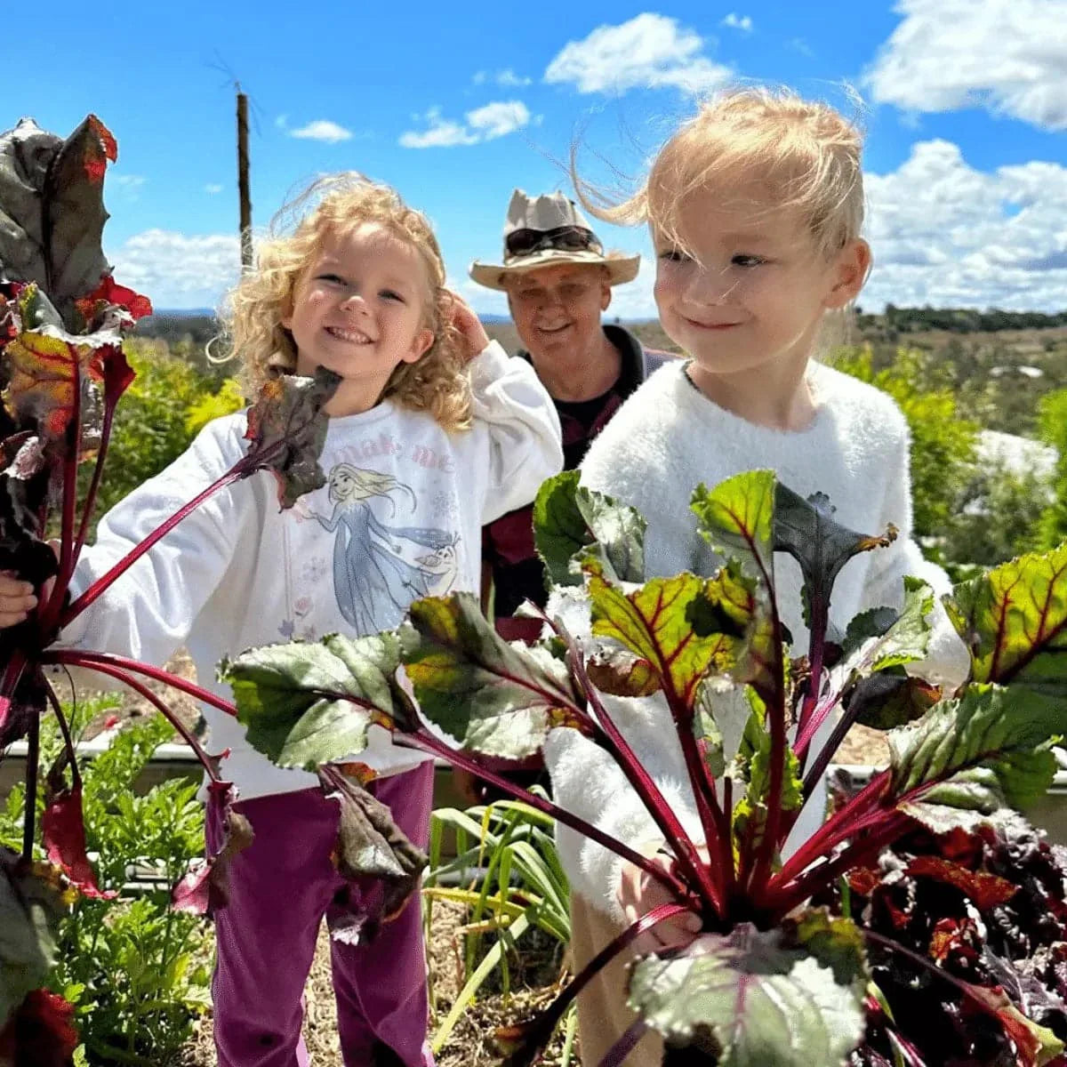 smiling kids with crops