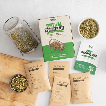 Survival sprouts kit with various seed packages and a sprouting guide on a white surface.